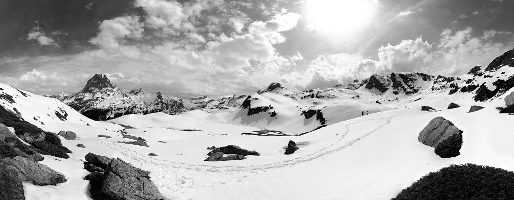 Picnic break in front of The peak of Midi d'Ossau B&W - Pyrenees, France